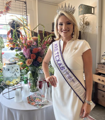 Tessa Smith wears her Mrs. Texas International crown and sash at All Things New in Georgetown during a celebration event.