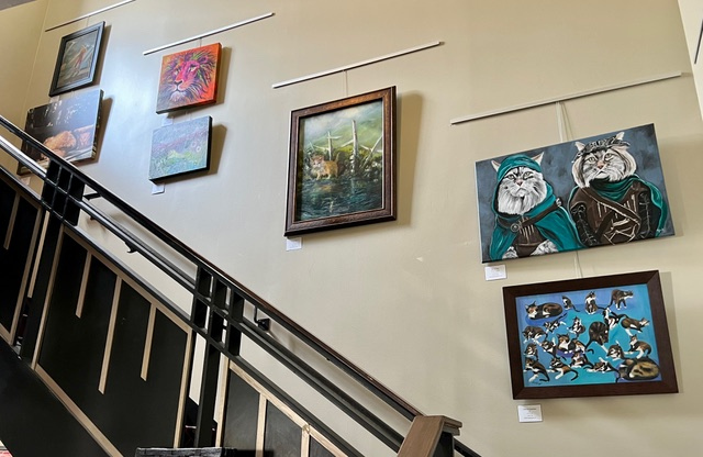 Artwork by WCAG artists on display in the Palace Theatre lobby during the production of “Cats.”