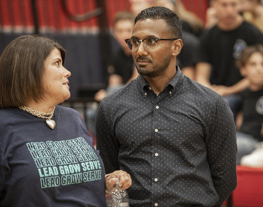 School district Chief of Staff Lindsay Harris, left, speaks with Superintendent Devin Padavil during the convocation for Georgetown Independent School District staff on Tuesday, August 6, 2024.   Georgetown public schools open on August 15.  Photo by Andy Sharp.