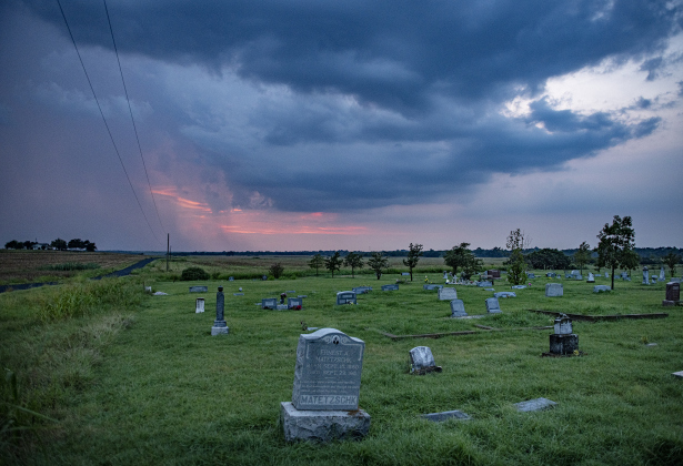 Storm clouds form over St. Peter's Church Cemetery along County Road 457 on Friday evening, August 9, 2024.  Although rain chances were only at 20 percent, this area south of Taylor received some much-needed moisture.