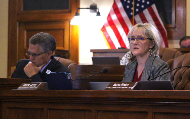 County Commissioner Valerie Covey presents her idea on how the death investigators would function if the county were to adopt them in the budget. Photo by Nalani Nuylan.