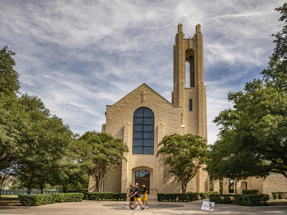 Students walk past Southwestern University's Lois Perkins Chapel  on Saturday, August 17, 2024. Completed in 1950, it is named for Southwestern alumnus Lois Perkins, who attended here from 1908-1911.   It is open every day from 8a.m. to midnight during semesters.   Photo by Andy Sharp.