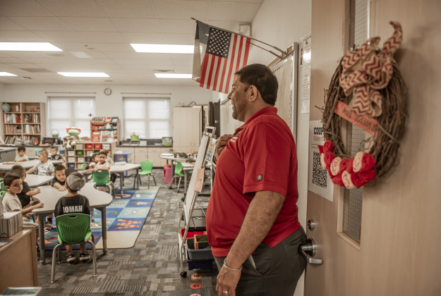 Principal Greg Vidal visits a Pre-K classroom  at Cooper Elementary on Thursday morning, August 15, 2024,  the first day of classes.   Cooper Elementary has 572 students enrolled this year.    Photo by Andy Sharp.