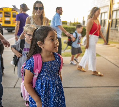 Sophia Avalos, 6, was anxious to join her first grade classmates  at Cooper Elementary on Thursday morning, August 15, 2024,  the first day of school.   Cooper Elementary has 572 students enrolled this year.    Photo by Andy Sharp.