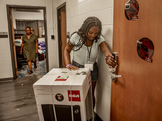 Remi Jobi, 18, front, an incoming freshman at Southwestern University, is assisted by her mother Carol Jobi as she moves into her room  in Mabee Hall on Saturday, August 17, 2024.  Southwestern classes begin on August 26th.   Photo by Andy Sharp.