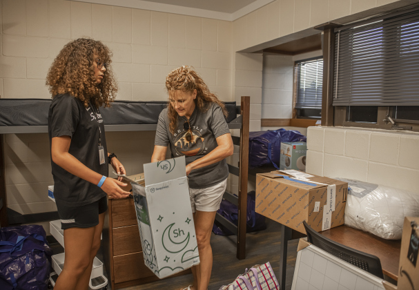 Peyton Brown,18, left,  an incoming freshman at Southwestern University, is assisted by her mother Lori Brown as she moves into her room  in Mabee Hall on Saturday, August 17, 2024.  Southwestern classes begin on August 26th.   Photo by Andy Sharp.