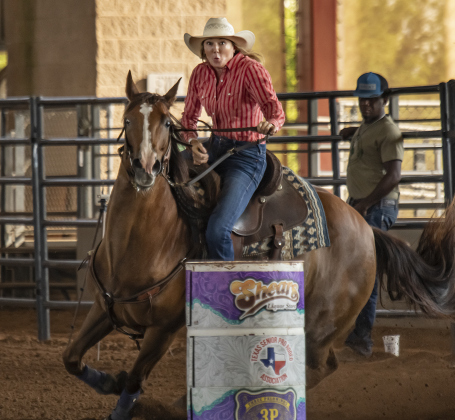 Kim Depaul of Athens, Texas competes in Barrel Racing.