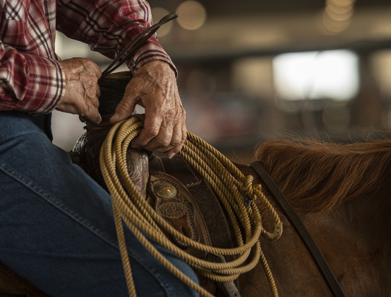 Rex Sandifer, 77, from Elgin, prepares to compete in 70 Breakaway Roping.