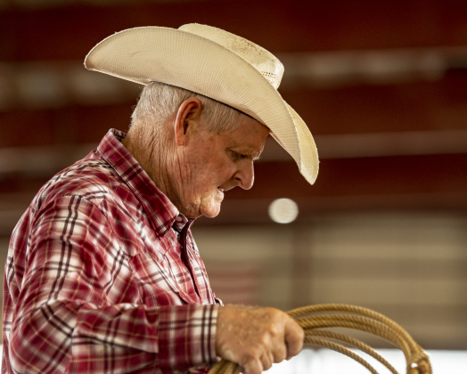 Rex Sandifer, 77, from Elgin, prepares to compete in 70 Breakaway Roping at the Texas Senior Pro Rodeo Association's  rodeo.