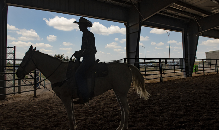 77-year-old Harry Fulton of Gatesville, Texas, astride his horse called T.R., has competed in rodeo for many years, but this year was here to support his wife Lois, who was competing in Ladies Breakway Roping.