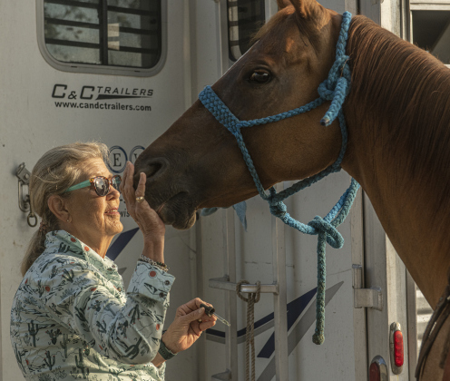 Jane Armstrong, a Barrel Racer from Bryan, applies some essential oils to her horse Mimosa before their arena time at the Texas Senior Pro Rodeo Association's  rodeo held at the Williamson County Expo Center on Saturday, August 24, 2024.