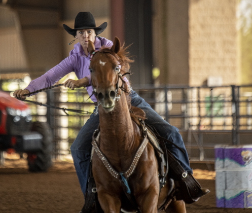 Mitzi Duke of McDade, Texas competes in Barrel Racing.