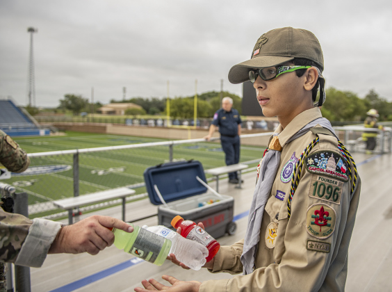 13-year-old Joaquin Diaz joined other members of his BSA Scout  Troop 1096 handing out hydration drinks to participants during the Memorial Stair Climb at Birkelbach Field on Wednesday, September 11, 2024, the 23rd anniversary of the attacks on United States soil in New York, Pennsylvania and Washington, D.C.  The Memorial Stair Climb began here in 2011.  Photo by Andy Sharp.