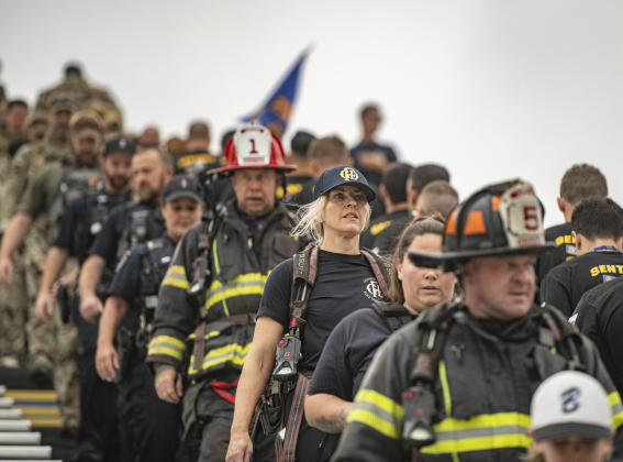 Georgetown Fire Department firefighter Nicola Gilmour (blond hair, wearing cap) takes part in the Memorial Stair Climb at Birkelbach Field on Wednesday, September 11, 2024, the 23rd anniversary of the attacks on United States soil in New York, Pennsylvania and Washington, D.C.   The Memorial Stair Climb began here in 2011.  Photo by Andy Sharp.