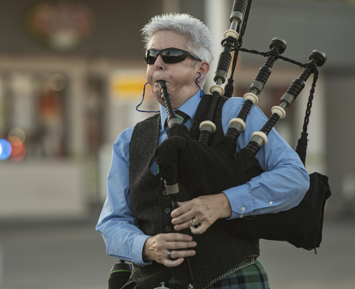 Lori Waters, with Silver Thistle Pipes &amp; Drums, plays her bagpipe during the Patriot Day observance on Wednesday evening, September 11, 2024.   Patriot Day commemorates the events of September 11, 2001.    Photo by Andy Sharp.