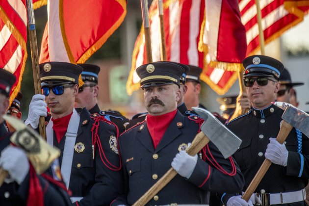 Members of the Taylor Fire Department take part in the parade along Main Street  during the Patriot Day observance on Wednesday evening, September 11, 2024.   Patriot Day commemorates the events of September 11, 2001.    Photo by Andy Sharp. 