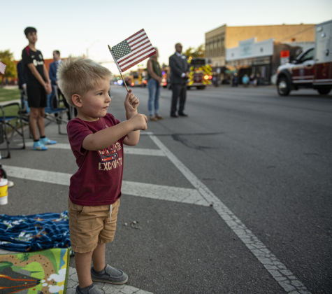 3-year-old Ryder Copeland watches the parade pass by along Main Street  during the Patriot Day observance on Wednesday evening, September 11, 2024.   Patriot Day commemorates the events of September 11, 2001.    Photo by Andy Sharp.