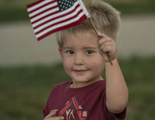 3-year-old Ryder Copeland watches as the parade passes along Main Street during the Patriot Day observance on Wednesday evening, September 11, 2024.   Patriot Day commemorates the events of September 11, 2001.    Photo by Andy Sharp.