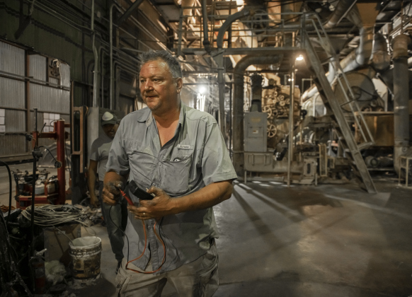 Gin co-owner David Woollett prepares to replace electrical fuses  at Waterloo Gin on Monday, September 9, 2024. Located on County Road 414 east of Taylor, the gin is co-owned by Clement Strmiska and David Woollett.   Photo by Andy Sharp.