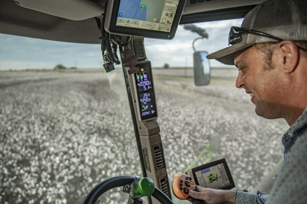  Aaron Martinka navigates his combine through a field of cotton along F.M. 972 east of Walburg  on Tuesday, September 10, 2024. Martinka is harvesting 1,100 acres of cotton this year.  Photo by Andy Sharp. 