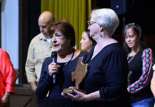 Peggy Morse, left, presents the Citizen of the Year Award to Linda Parchman, right, at the Gala.