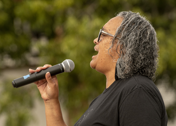 Terri Moore Mays performs "The Star-Spangled Banner" as cyclists doing the 25-mile ride prepare to  begin their event  at Murphy Park for the annual Mamma Jamma Ride.