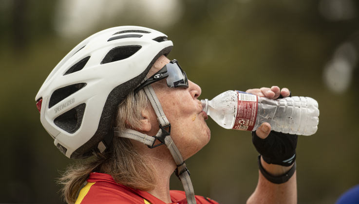 Cyclist Cheri Courtney has a cool drink of water before beginning her 25-mile ride  at Murphy Park for the annual Mamma Jamma Ride on Saturday, September 21, 2024.