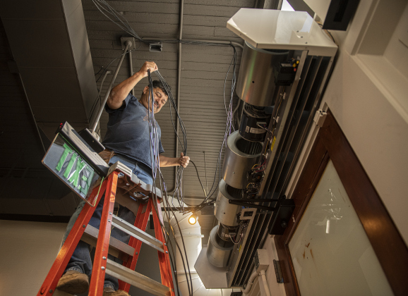 Victor Martinez works on wiring for what will soon be  the front entrance to Tecovas.