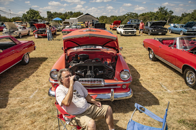teve Chapman relaxes in front of his 1954 Plymouth Belvedere during the car and motorcycle show held at the the College Street VFW Post 8587 on Saturday, September 21, 2024.   This is the post's inaugural car show.   Photo by Andy Sharp. 