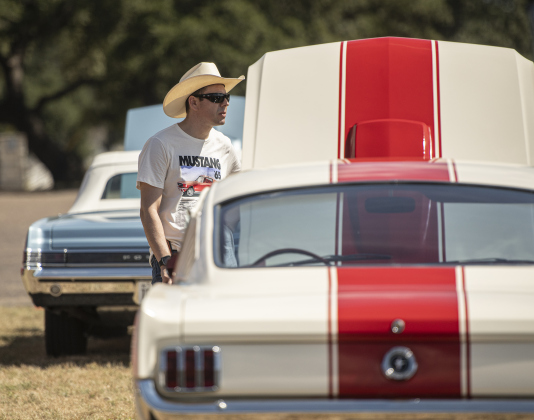 Martin Leal stands next to his 1965 Ford Mustang  during the car and motorcycle show held at the the College Street VFW Post 8587 on Saturday, September 21, 2024.   This is the post's inaugural car show.   Photo by Andy Sharp.