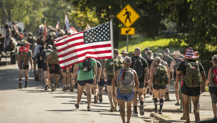 Members of Irreverent Warriors group continued their 6.1 mile Silkies Hike along East 7th Street.