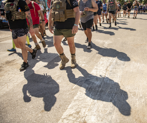Members of  Irreverent Warriors group, here leaving the area around Gus's Drugs,  continued their 6.1 mile Silkies Hike through Georgetown on Saturday, September 21, 2024.
