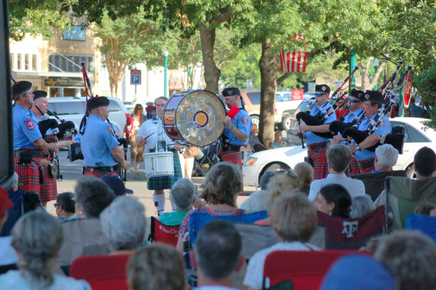 The Georgetown Fire Department Pipes and Drums play at a summer concert in 2018.