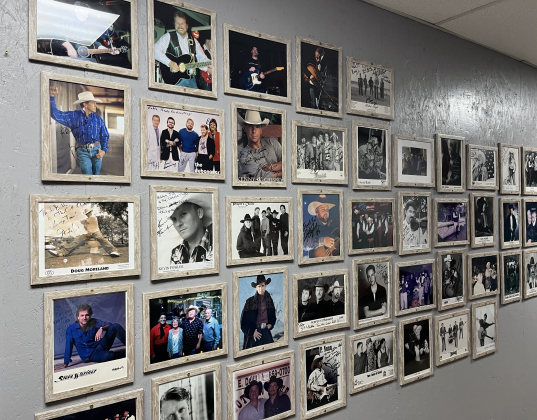 The “Wall of Fame” at Cotton Country Club featuring stars such as Kevin Fowler and Steve Wariner. Photo by Abbey Archer