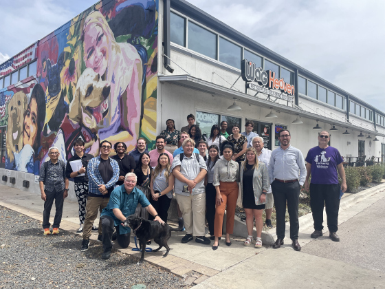 Wag Heaven hosts a group of business students — who represent colleges from across the country — for a tour of multiple spots in Georgetown in August 2023 in an effort to promote good business practices in the area. With the group are co-owners Jeff Manley (front, with dog) and Jusak Yang Bernhard (third from right), as well as Georgetown Director of Economic Development Cameron Goodman (second from right), who spoke to the students about Georgetown’s small business landscape. Photo by Nicholas Cicale