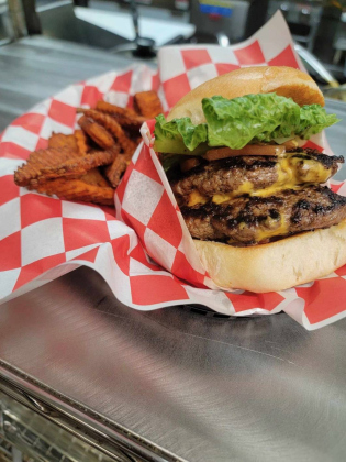 Double cheese burger with sweet potato fries at Cotton Country Club. Photo courtesy of Emily Hamilton