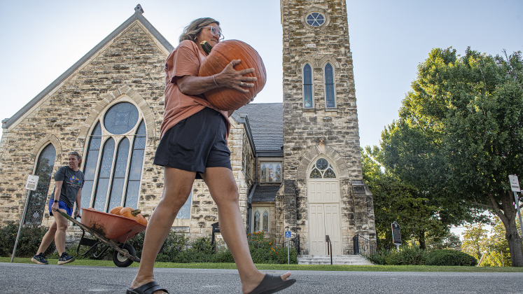 Reverend Tina Schramme, an Associate Pastor at First United Methodist Church in Georgetown was one of many on hand to help unload pumpkins at First United Methodist Church on Wednesday, October 9, 2024.