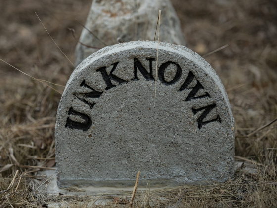 Joe Plunkett, with the Cemetery Restoration Volunteers, added "Unknown" to several burial sites  at the circa 1851 McFadin Cemetery on Tuesday, October 8, 2024. Plunkett and his group led the effort to restore this cemetery near the San Gabriel River in recent years.     Photo by Andy Sharp.