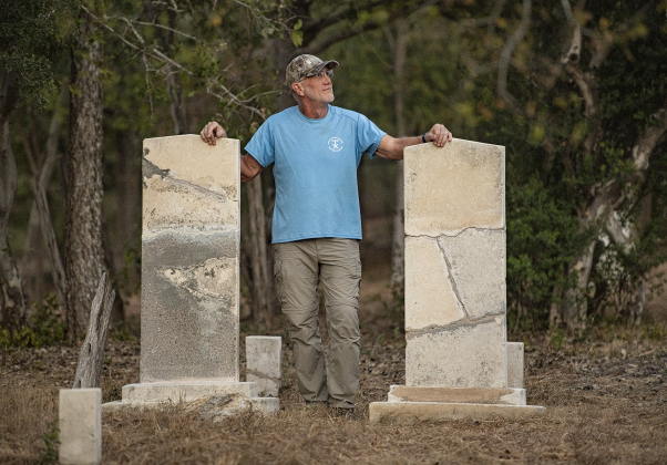 Joe Plunkett, with the Cemetery Restoration Volunteers, poses for a photograph  at the circa 1851 McFadin Cemetery on Tuesday, October 8, 2024. Plunkett and his group led the effort to restore this cemetery near the San Gabriel River in recent years.     Photo by Andy Sharp.