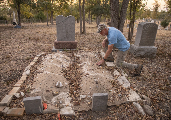 Joe Plunkett, with the Cemetery Restoration Volunteers, looks over burial sites  at the circa 1851 McFadin Cemetery on Tuesday, October 8, 2024. Plunkett and his group led the effort to restore this cemetery near the San Gabriel River in recent years.     Photo by Andy Sharp.