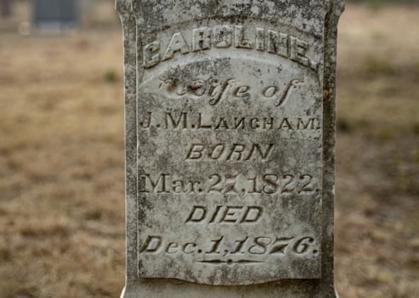 A gravestone continues to provide details about a person's life  at the circa 1851 McFadin Cemetery on Tuesday, October 8, 2024. Joe  Plunkett and his group, Williamson County Cemetery Restoration Volunteers,  led the effort to restore this cemetery near the San Gabriel River in recent years.     Photo by Andy Sharp.