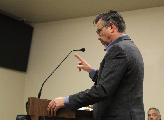Williamson County Tax Assessor/Collector Larry Gaddes appears at Jarrell City Council to explain the potential effects if the city council passes the tax rate on September 30. Photo by Nalani Nuylan.