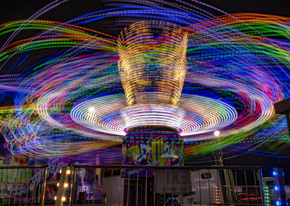 A midway ride lights up the night skies  during the Williamson County Fair &amp; Rodeo opening night at the Williamson County Expo Center on Wednesday, October 23, 2024.  The fair and rodeo continues through Saturday, October 26th.   Photo by Andy Sharp.