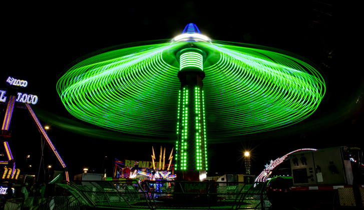 A midway ride lights up the night skies during the Williamson County Fair &amp; Rodeo opening night at the Williamson County Expo Center on Wednesday, October 23, 2024.  The fair and rodeo continues through Saturday, October 26th.   Photo by Andy Sharp.