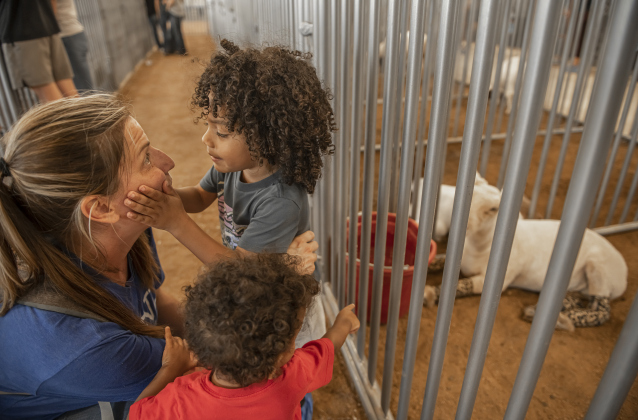 Georgetown High teacher Jani Morachel spends time with her sons, including Jadon, one-and-a-half years old, and Caleb, 3, as they enjoy the sights during the Grand Opening of Georgetown High School's new Ag barn on Wednesday, September 25, 2024.   Photo by Andy Sharp.
