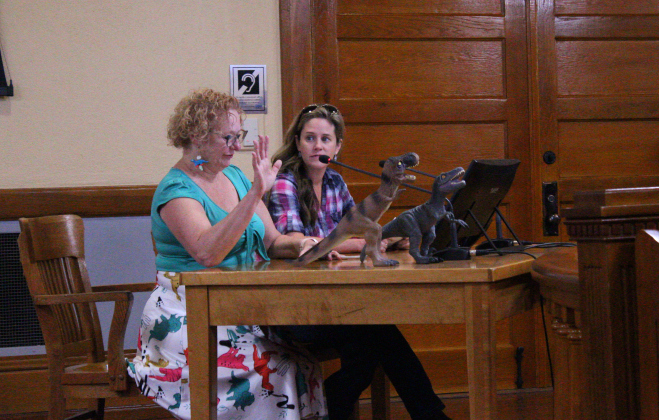 Kimberly Keller, left, advocates for Arterial K to be moved away from Possum Creek during the October 22 Commissioners Council meeting.  Photo by Nalani Nuylan.