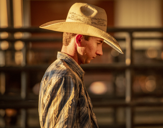 Regan Lyons, a Saddle Bronc rider from Australia currently living in Snyder, Texas, gets ready to compete  at the Williamson County Fair Rodeo  on Friday, October 25, 2024.    Photo by Andy Sharp.