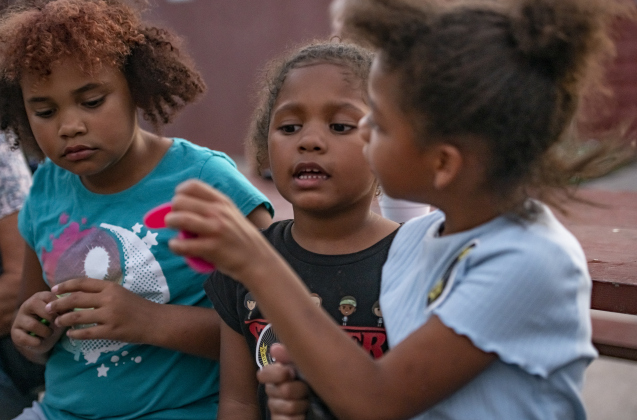 9-year-old Jaiden Littleton, left, and her sisters Charlie, 5, center, and Javion, 7, right, had a good time  during a National Night Out event held on Tuesday, October 1, 2024 at the Georgetown Housing Authority Activity Learning Center on West 18th Street.    Photo by Andy Sharp.