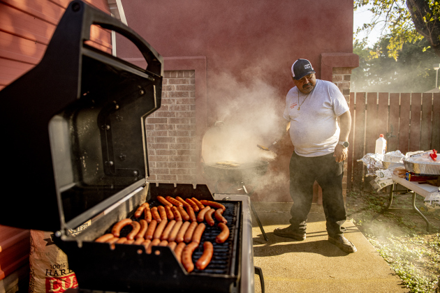 Osbaldo Kancheff grills burgers and hot dogs during a National Night Out event held on Tuesday, October 1, 2024 at the Georgetown Housing Authority Activity Learning Center on West 18th Street.    Photo by Andy Sharp.