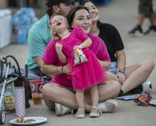 Bailey Myers and her daughter Raelynn Schoonover, 2, had a fun night  during a National Night Out event held on Tuesday, October 1, 2024 at the Georgetown Housing Authority Activity Learning Center on West 18th Street.    Photo by Andy Sharp.